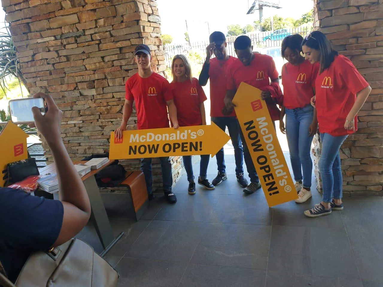 Promoter team holding sign spinner campaign boards