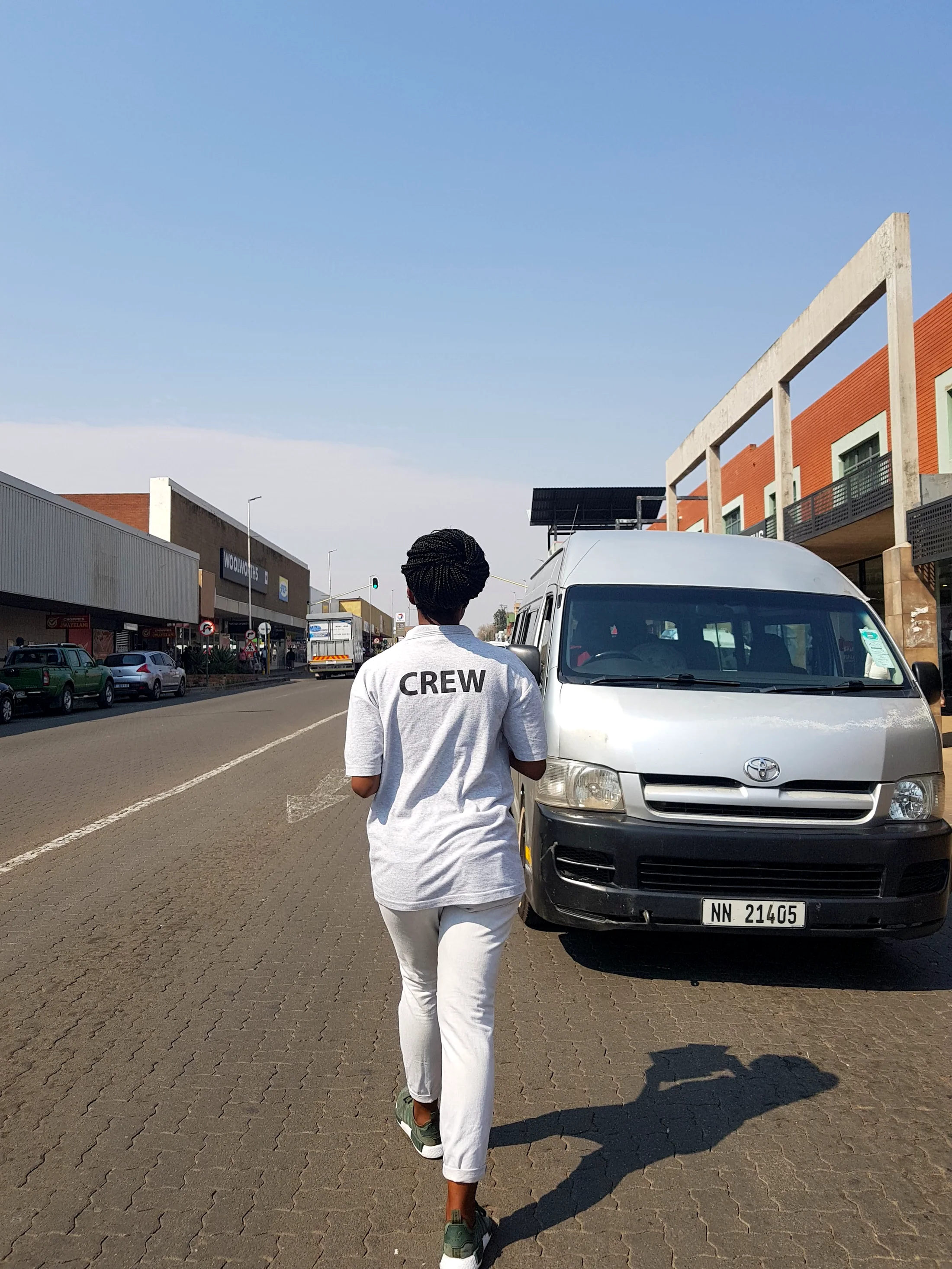 Field crew walking through a street-level campaign environment