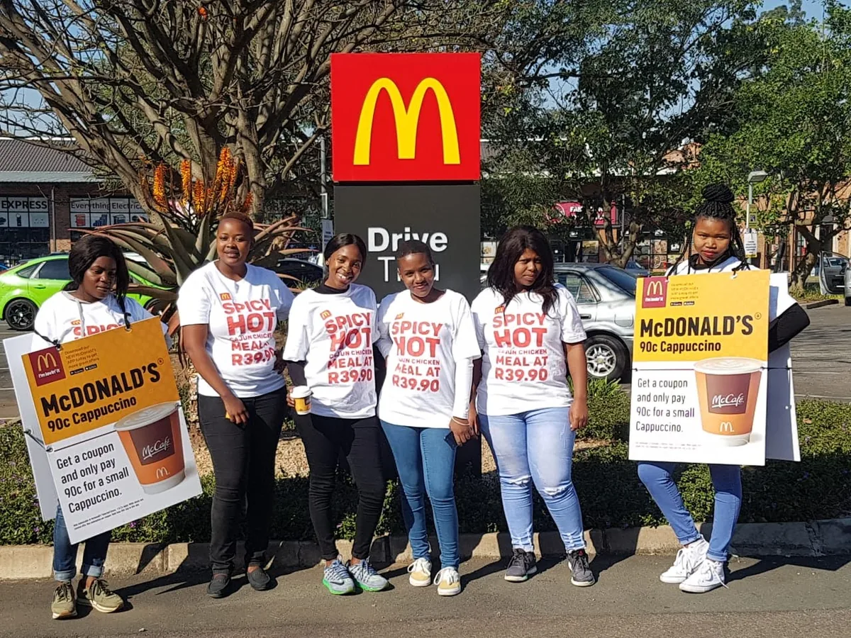 McDonald's promoter team with campaign placards