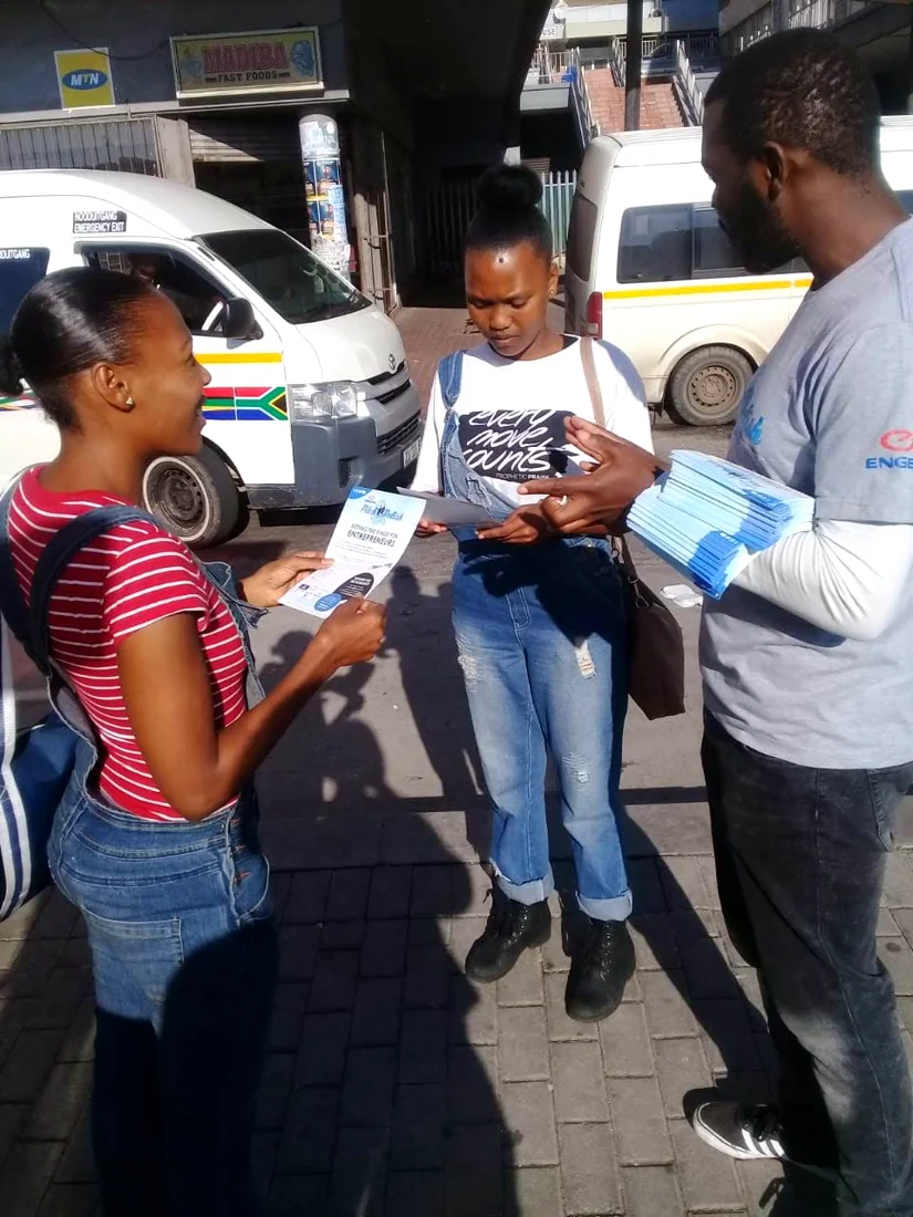Printed material handover during a street campaign