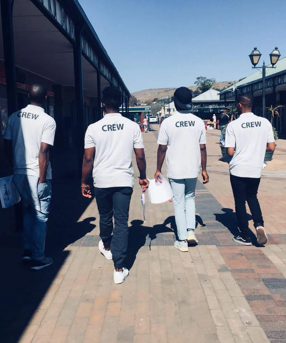 Field activation crew walking through a retail environment