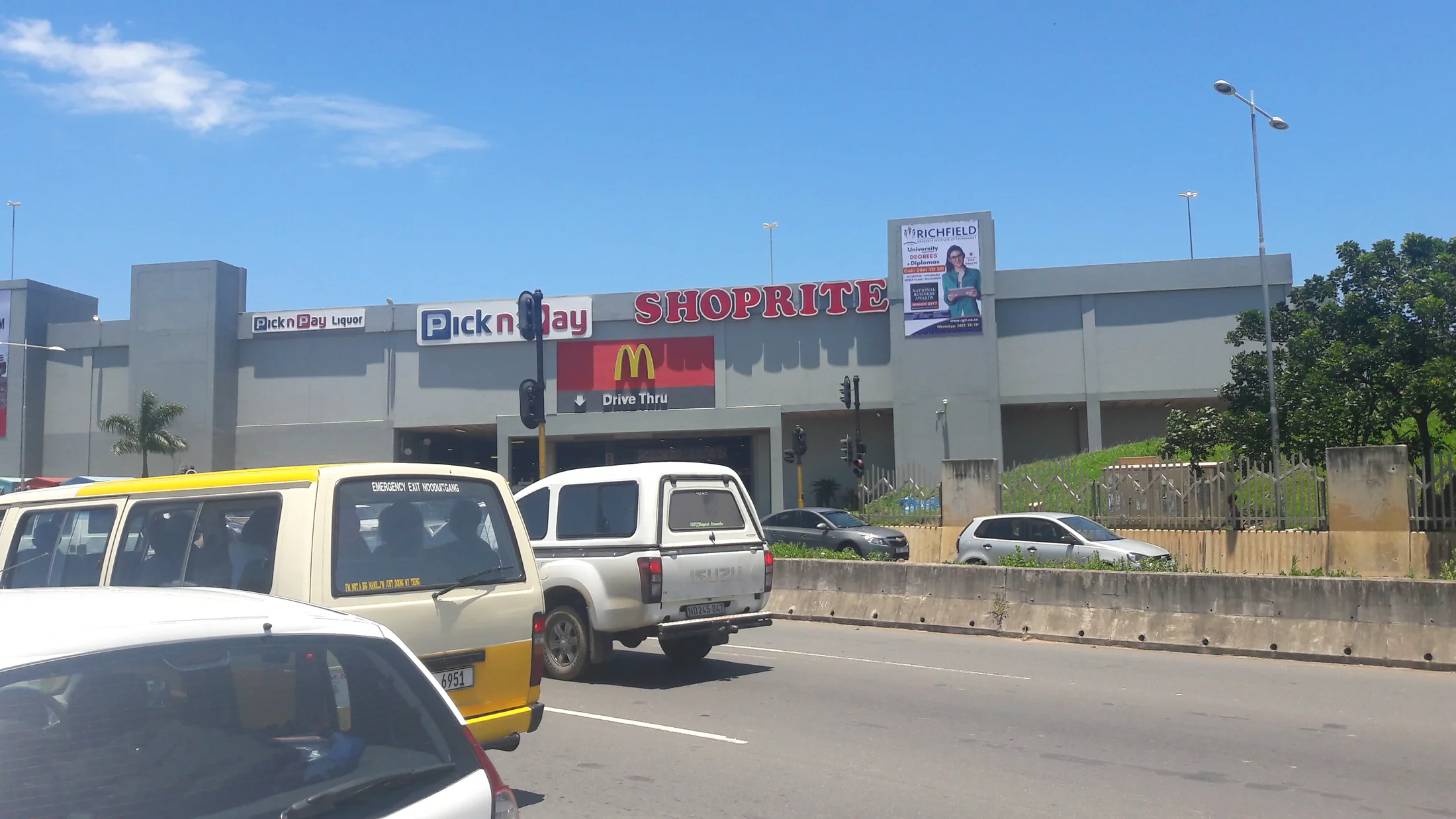 Kvamnyandu mall billboard seen from a busy retail road